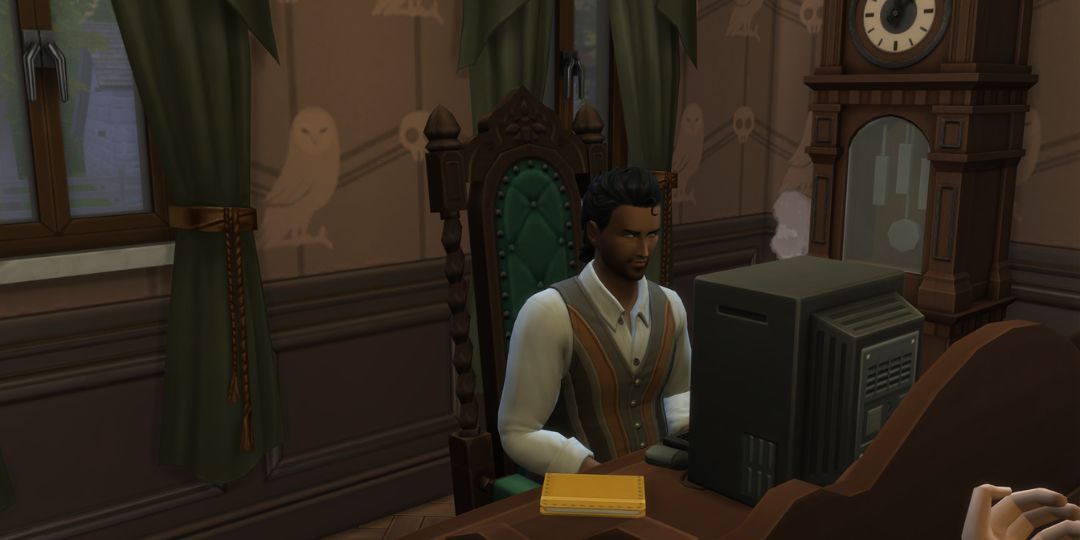 Radwan Gomes sits at a computer desk.