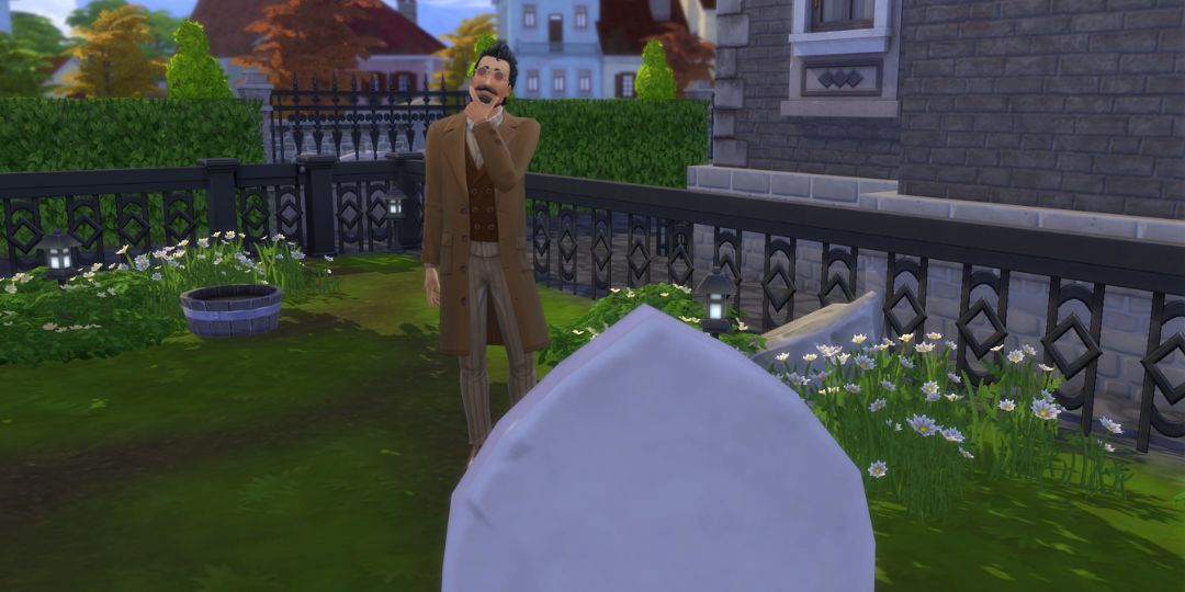 Layne Coffin stands in front of a grave, pondering.