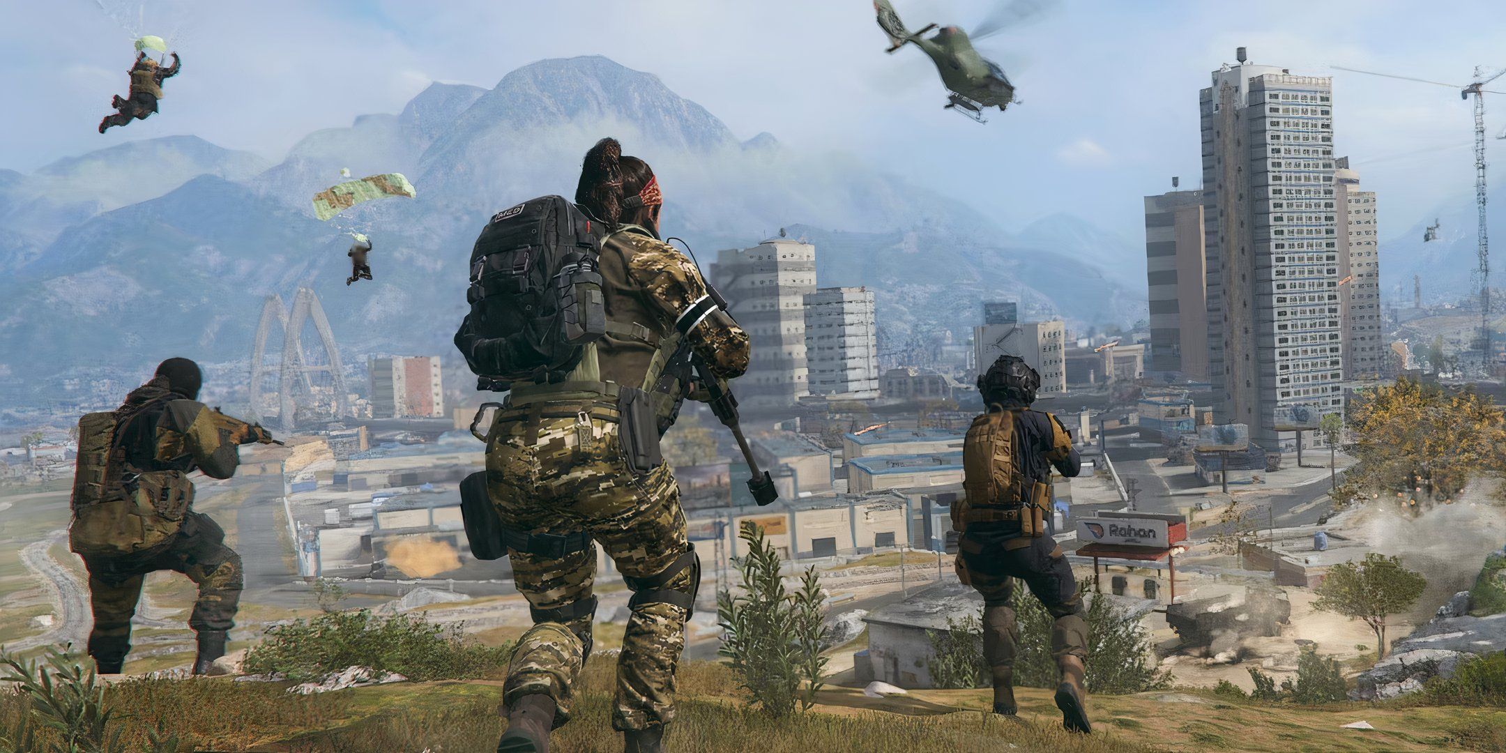 Three soldiers running across grass towards a city in the distance in CoD Modern Warfare 3.