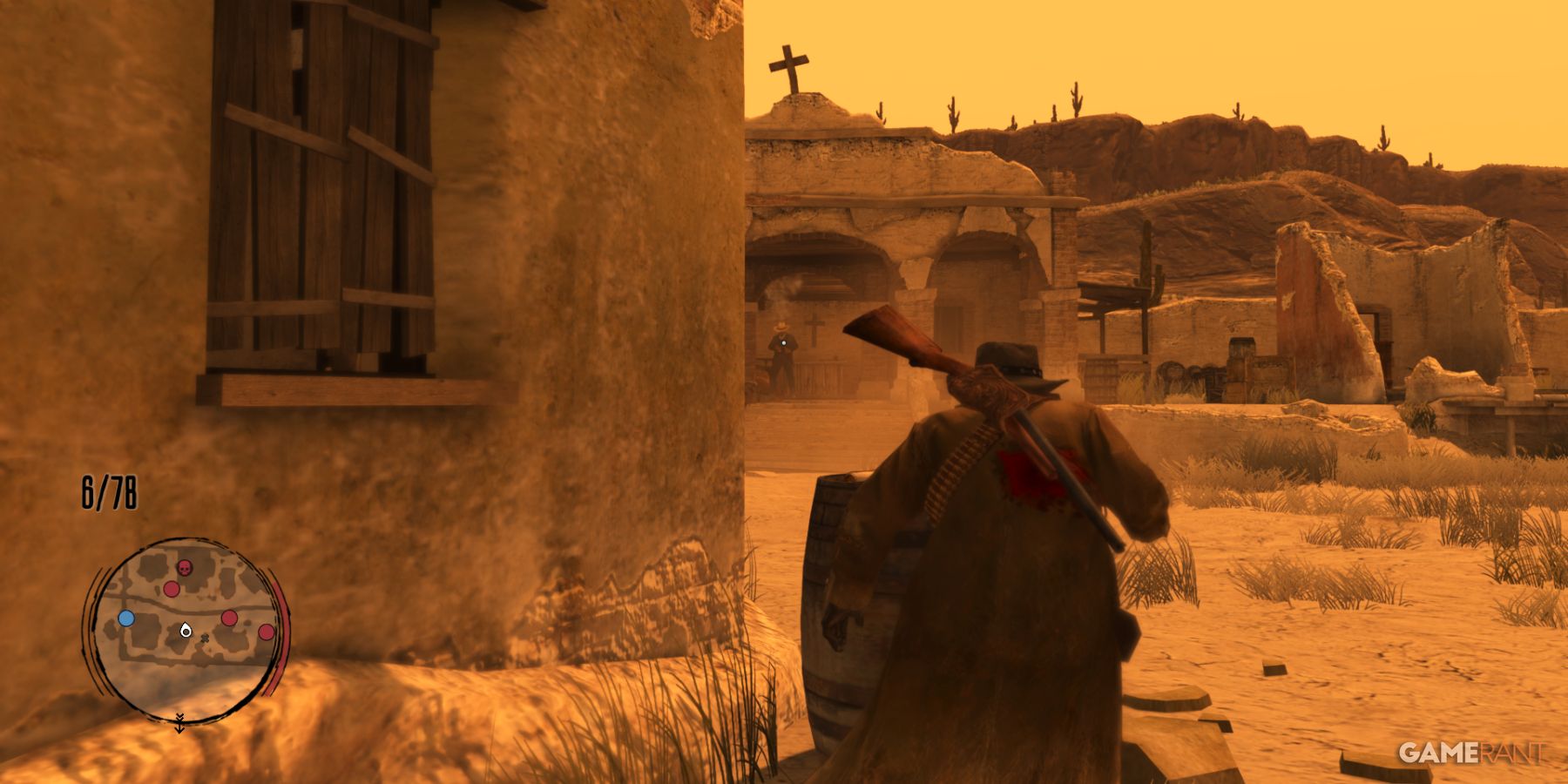 John Marston taking cover during a sunset standoff in a ruined desert outpost in Red Dead Redemption