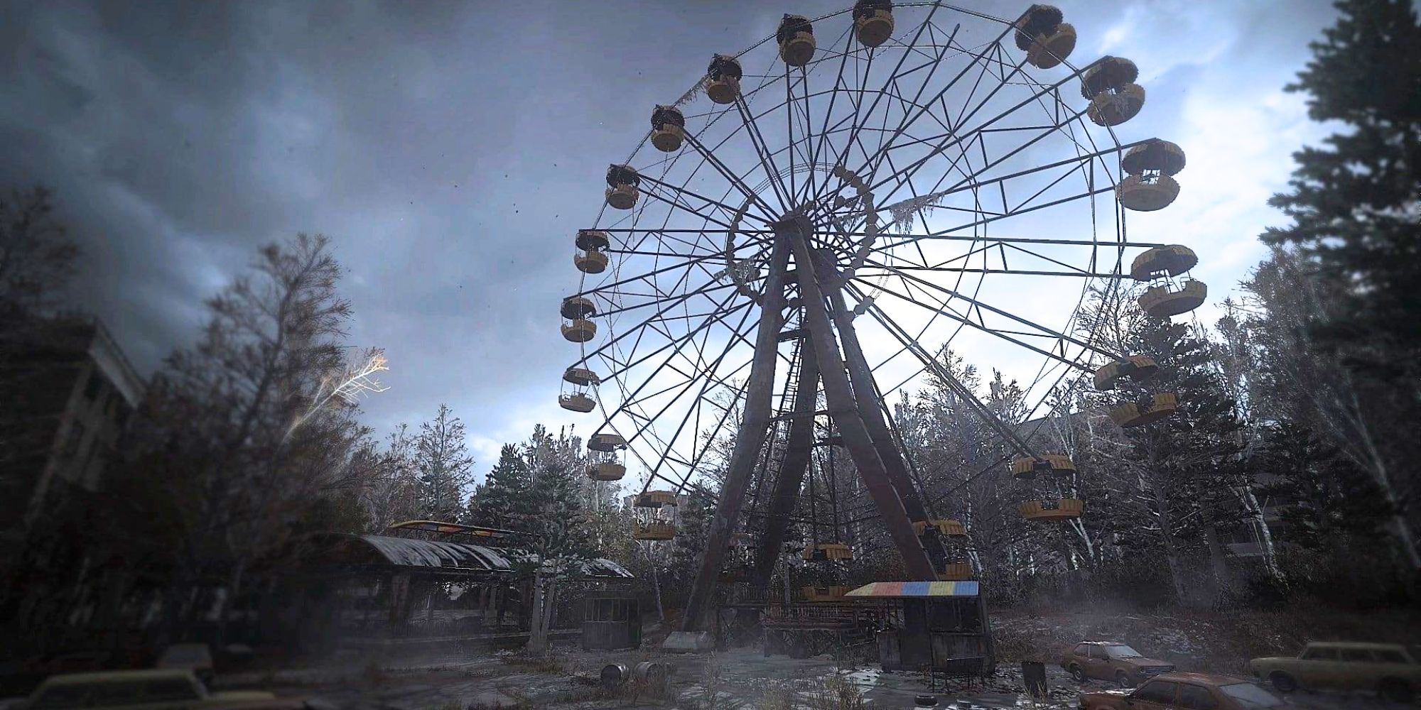 A giant Ferris Wheel next to abandoned shacks 