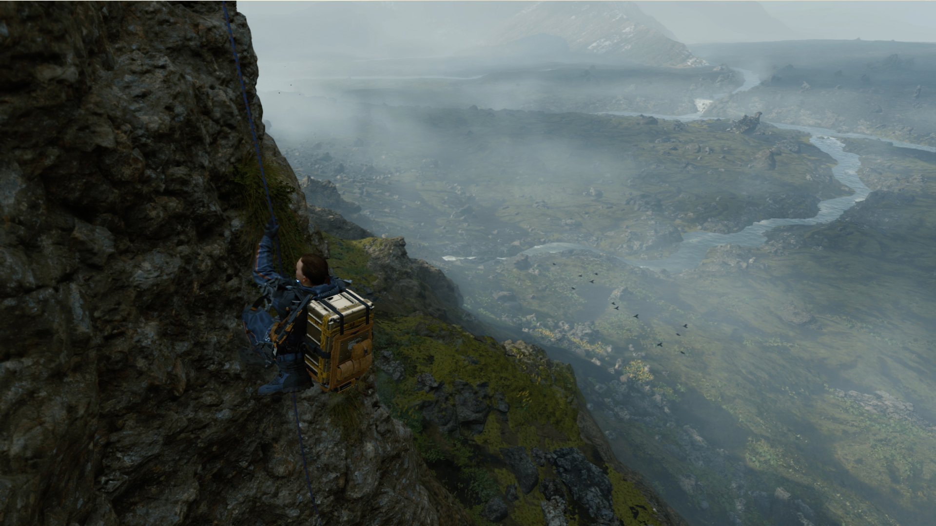 Death Stranding screenshot showing character climbing a steep mountain