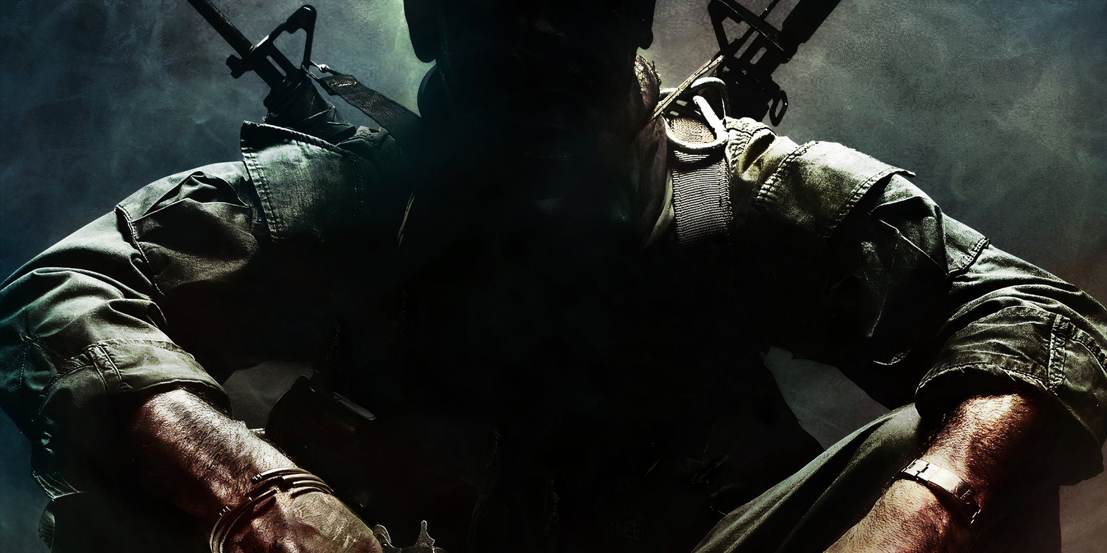 The key art for Call of Duty: Black Ops featuring a soldier sitting with guns strapped to his back and in his hands