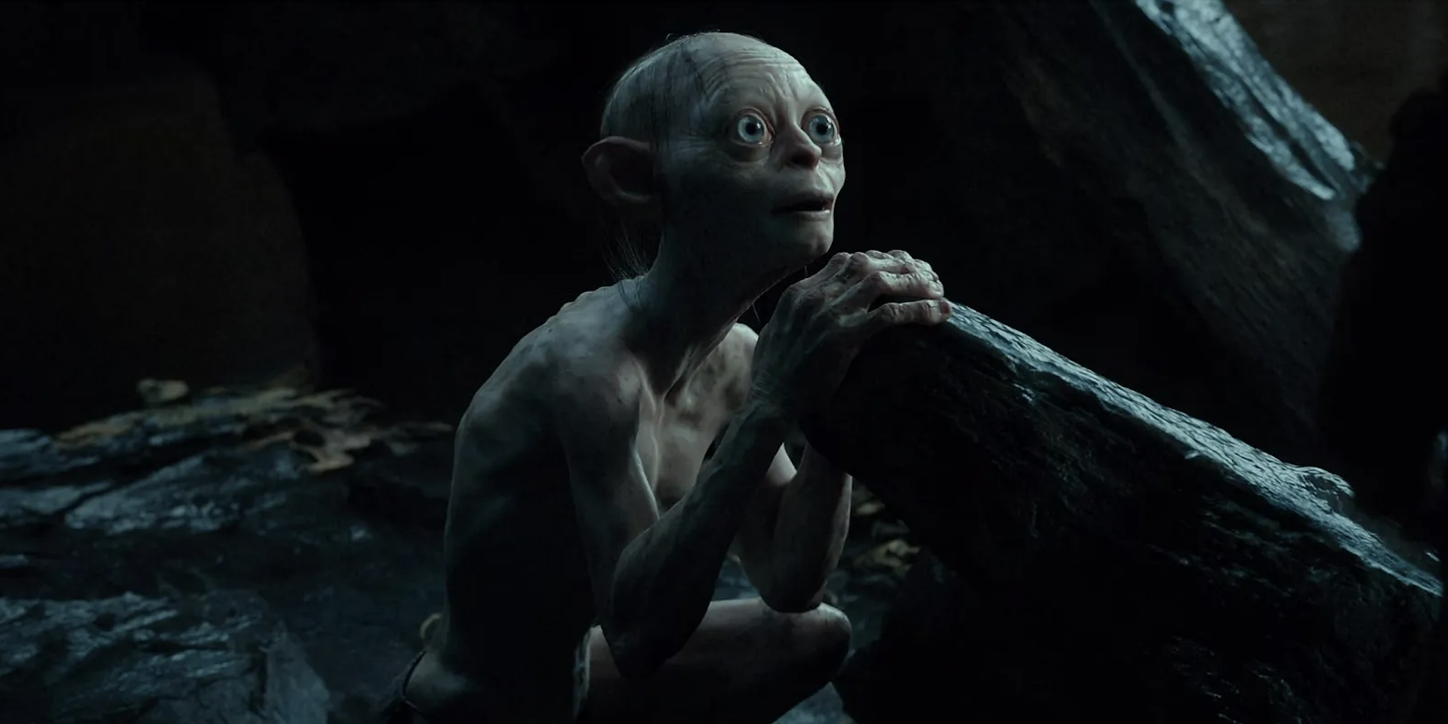 Gollum leaning on a rock with eyes wide from The Hobbit