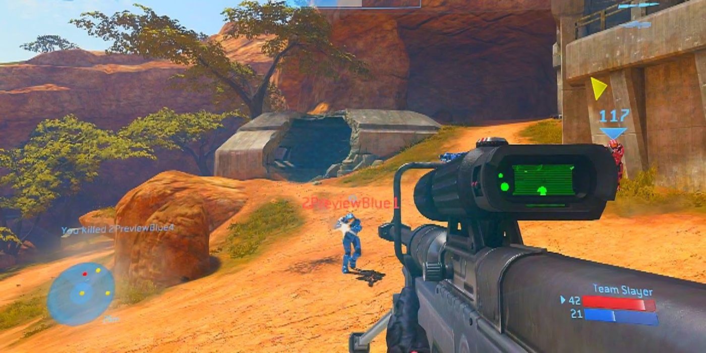 Halo Mastercheif Collection Multiplayer of the player aiming a sniper in the desert at enemy with a machine gun