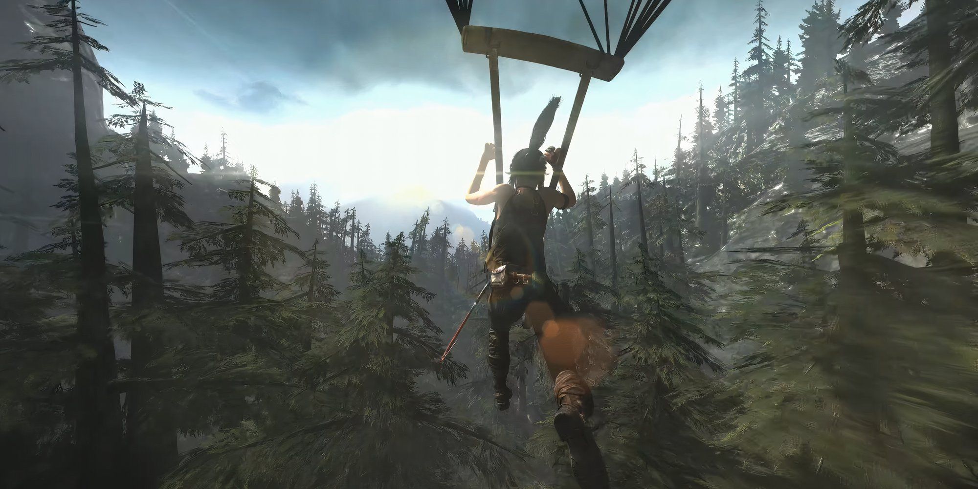 Gameplay moment showing Lara descending through a dense forest with a parachute.