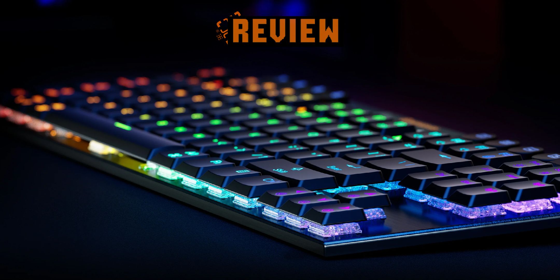 Hexgears A3 Immersion keyboard lit up in rainbow RGB colours on a blue and black background with the word Review at the top