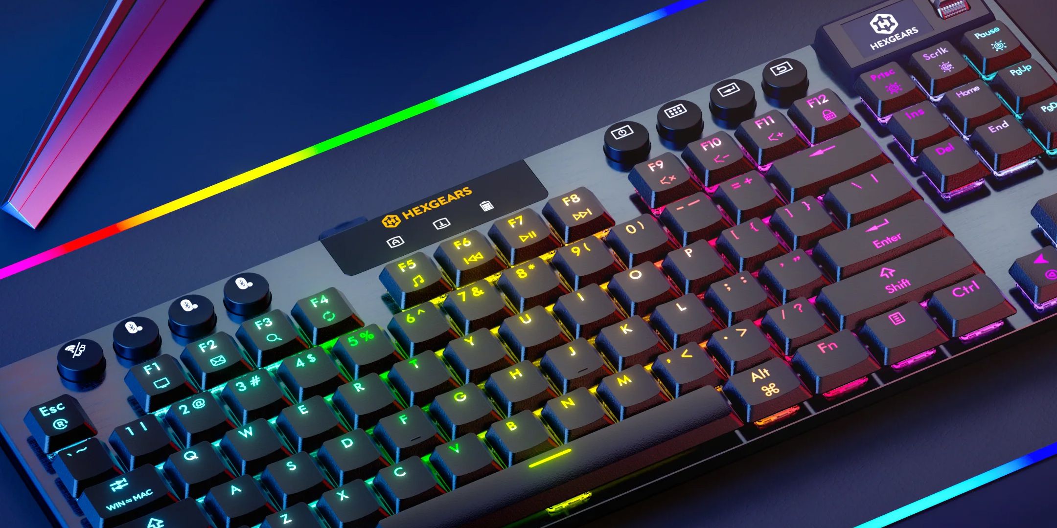 Hexgears A3 Immersion keyboard lit up in rainbow RGB colours on a plain desk