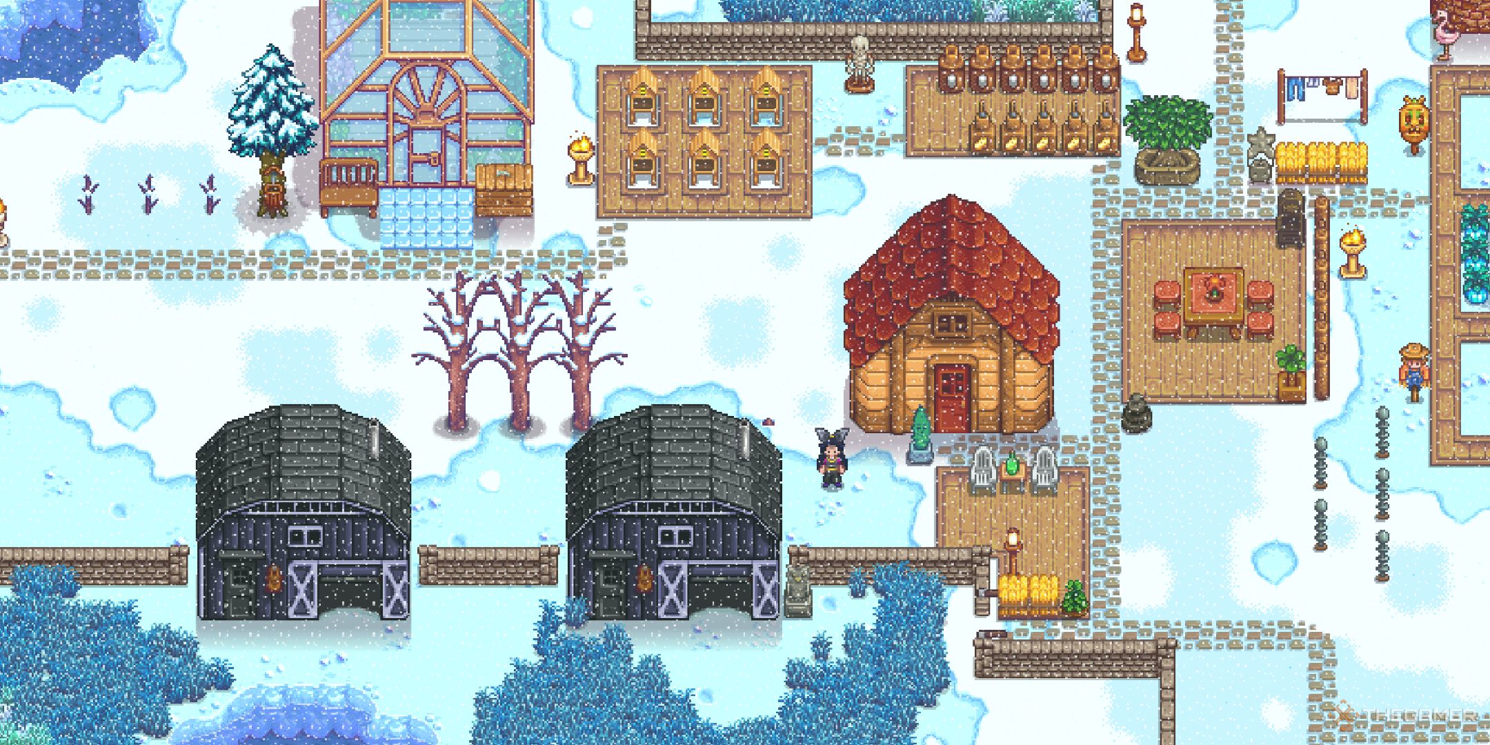 Stardew Valley farm buildings in winter (zoomed out with player standing in center).