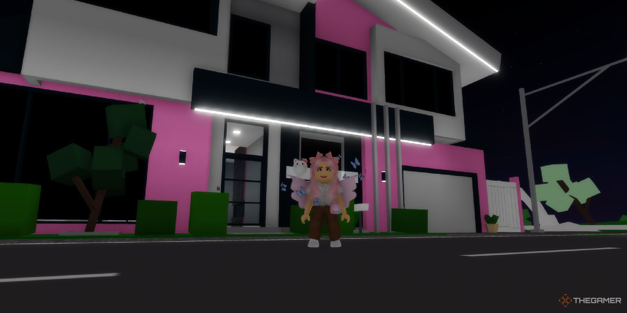 roblox brookhaven player standing in front of pink house