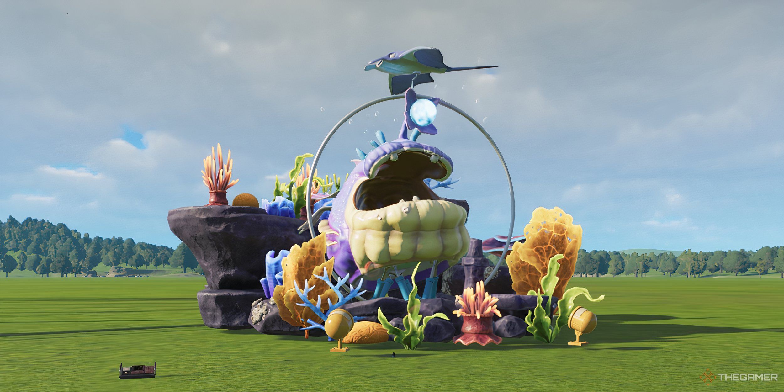 A giant animatronic fish in a field surrounded by aquantic scenery pieces like coral.