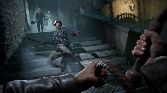 Indiana Jones on Game Pass: first person view of a man holding a whip as someone in their line of sight falls down some stairs.