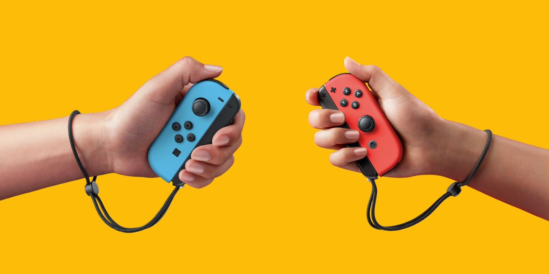 A pair of hands holding Nintendo Switch Joy-Cons against a yellow background.