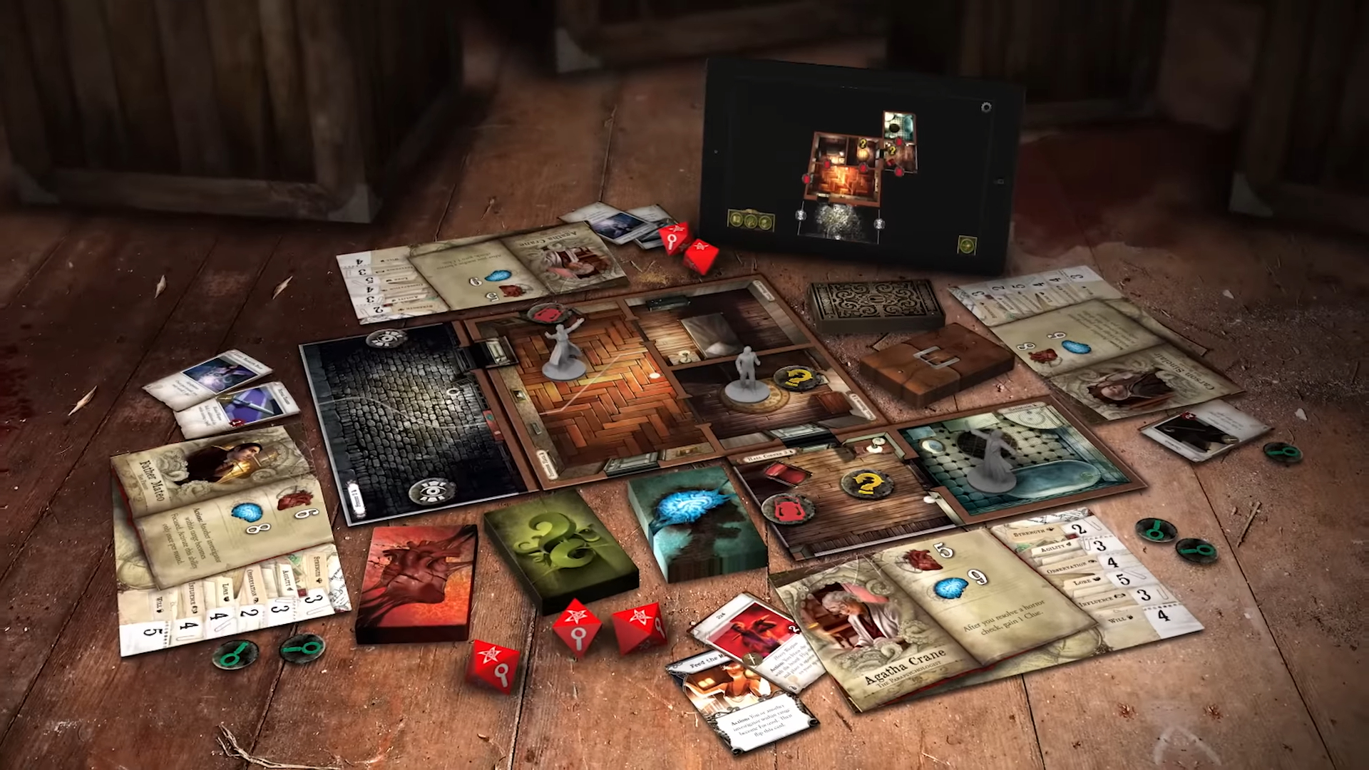 Mansions of Madness board, cards, tokens, and items laid out on a wooden table beside a tablet showing the game's app