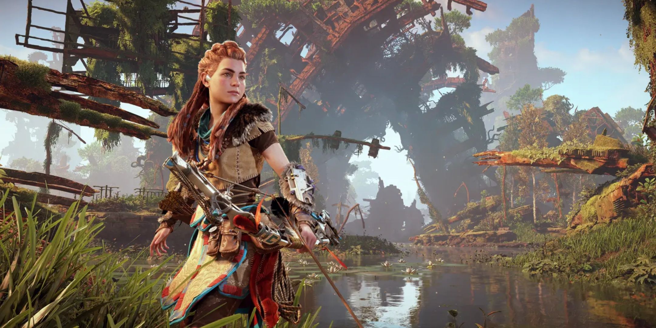 Aloy in Horizon Zero Dawn Remastered poses in front of a waterscape.