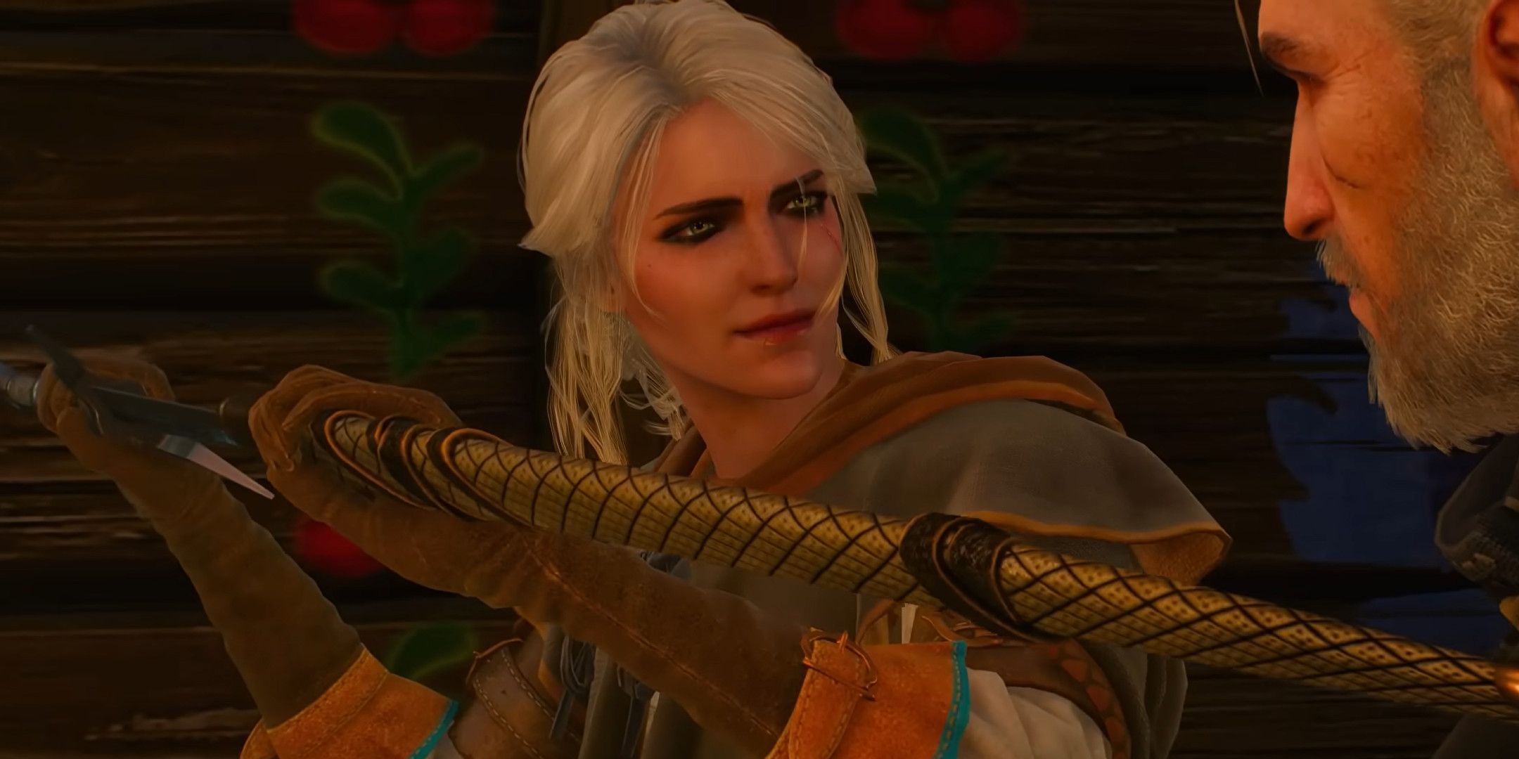 Ciri holding a sword in a scabbard while talking to Geralt