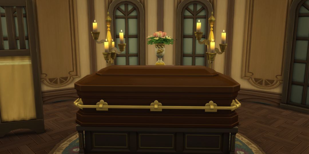 A coffin from the Sims 4. It is a rich brown and surrounded by candles.