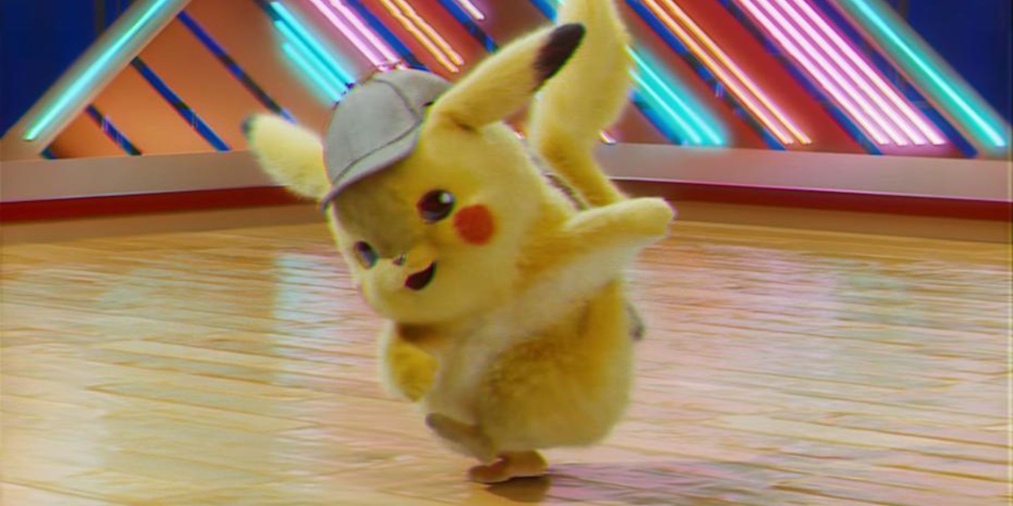 Detective Pikachu dancing in front of neon lights.