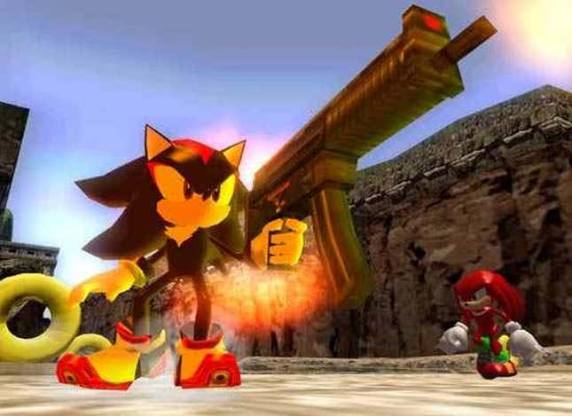 Shadow holds a gun in one hand while Knuckles walks beside him.