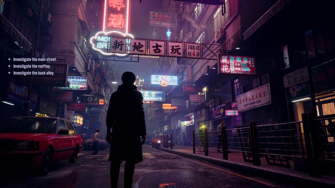 A screenshot from Slitterhead showing a man standing on a busy street at night. Around him, people walk up and down the pavements and above, neon lights glow. Right of centre, a yellow light glows on a woman's face, intimating Hyoki can possess her if need be.