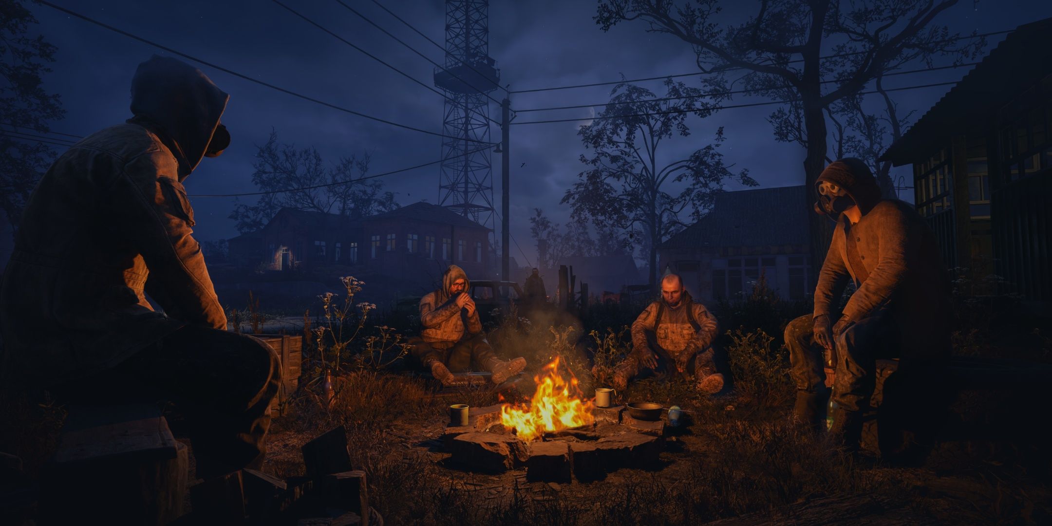 A group of soldiers sit around a campfire in Stalker 2. 