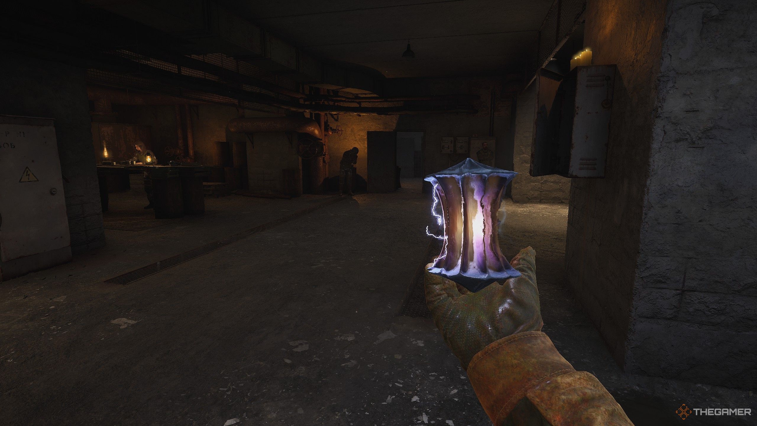 Stalker 2: Heart of Chornobyl gameplay of the player holding a strange artifact.