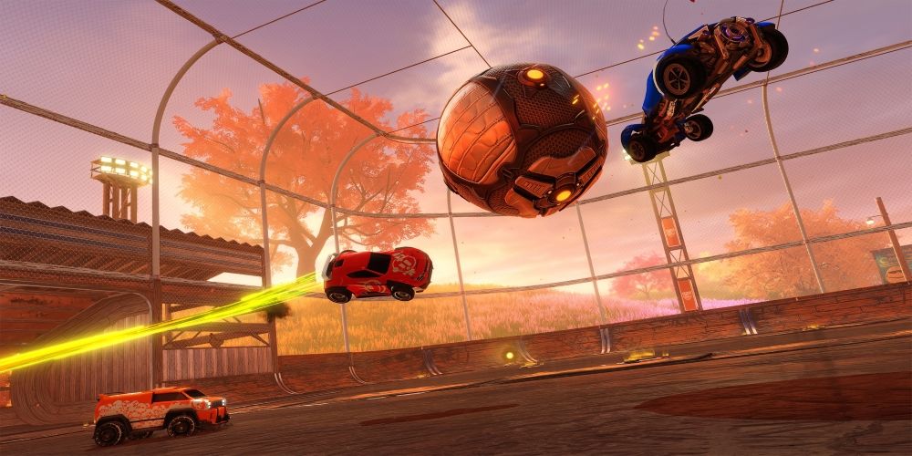 Farmstead Cars flying after the ball in a Rocket League arena.