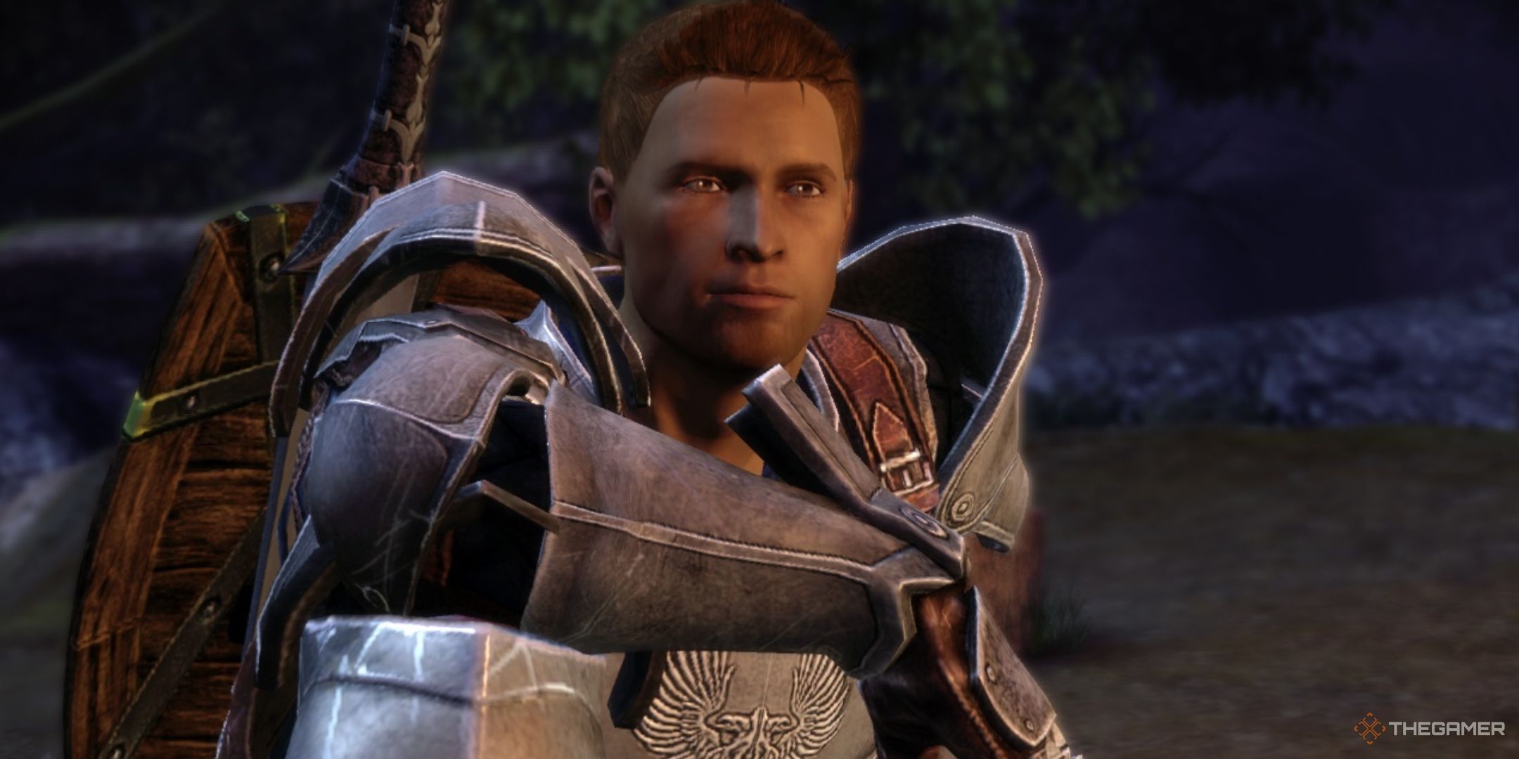 Alistair wearing armour and sitting down at camp in Dragon Age: Origins