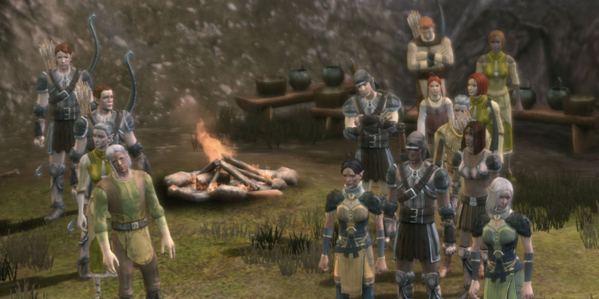 Dragon Age Origins Dalish Clan crowded around a bonfire.