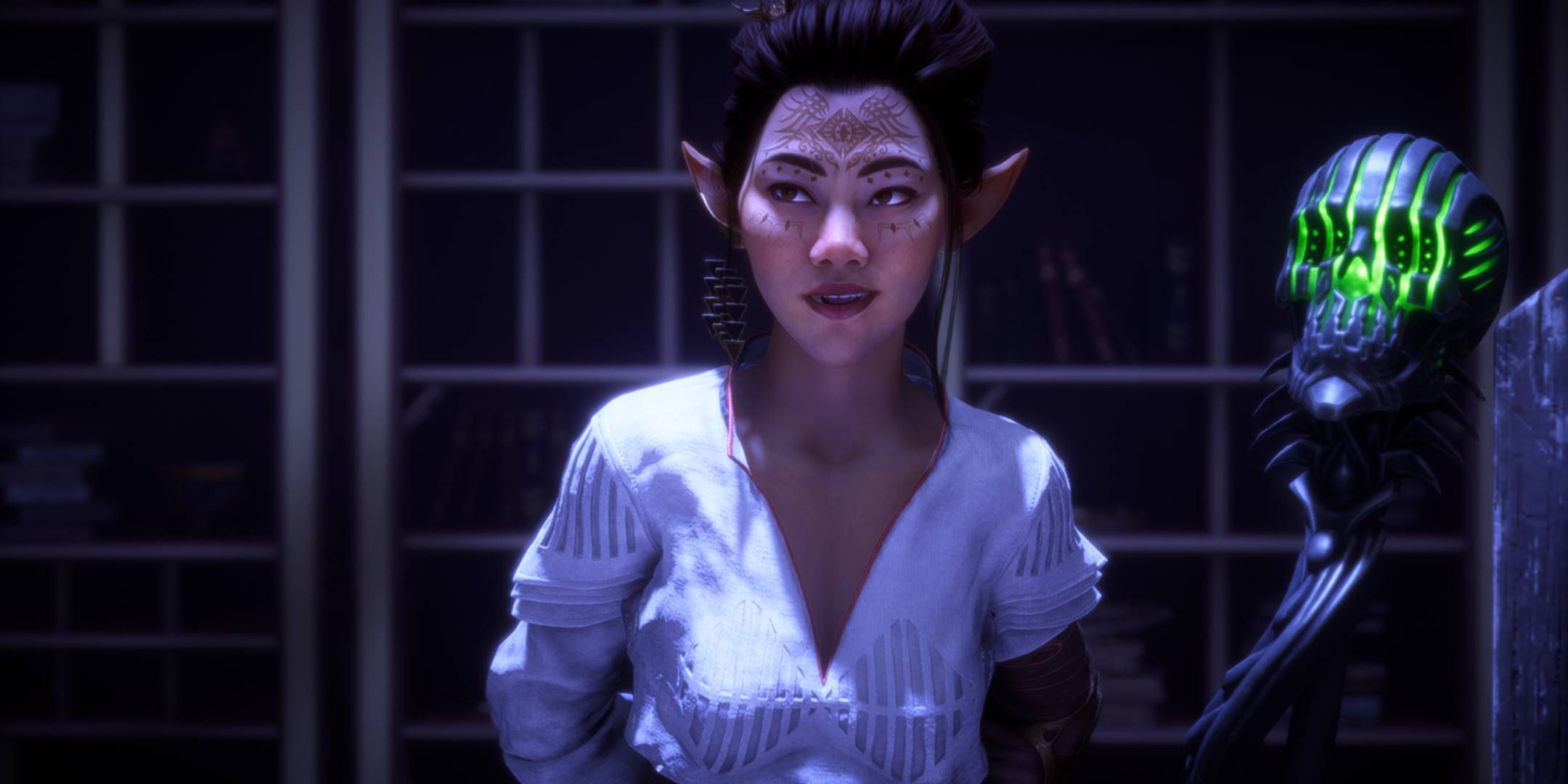 Bellara Lutare smiling in Emmrich's room with a skull staff behind her in Dragon Age: The Veilguard.