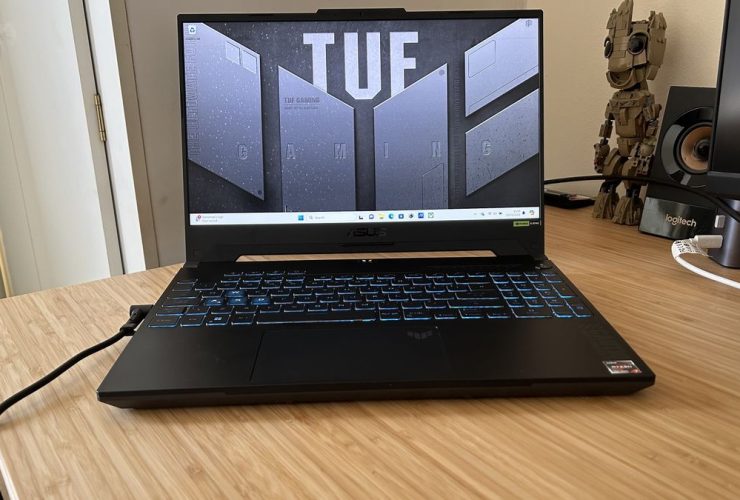 Asus TUF A15 gaming laptop open on a wooden desk