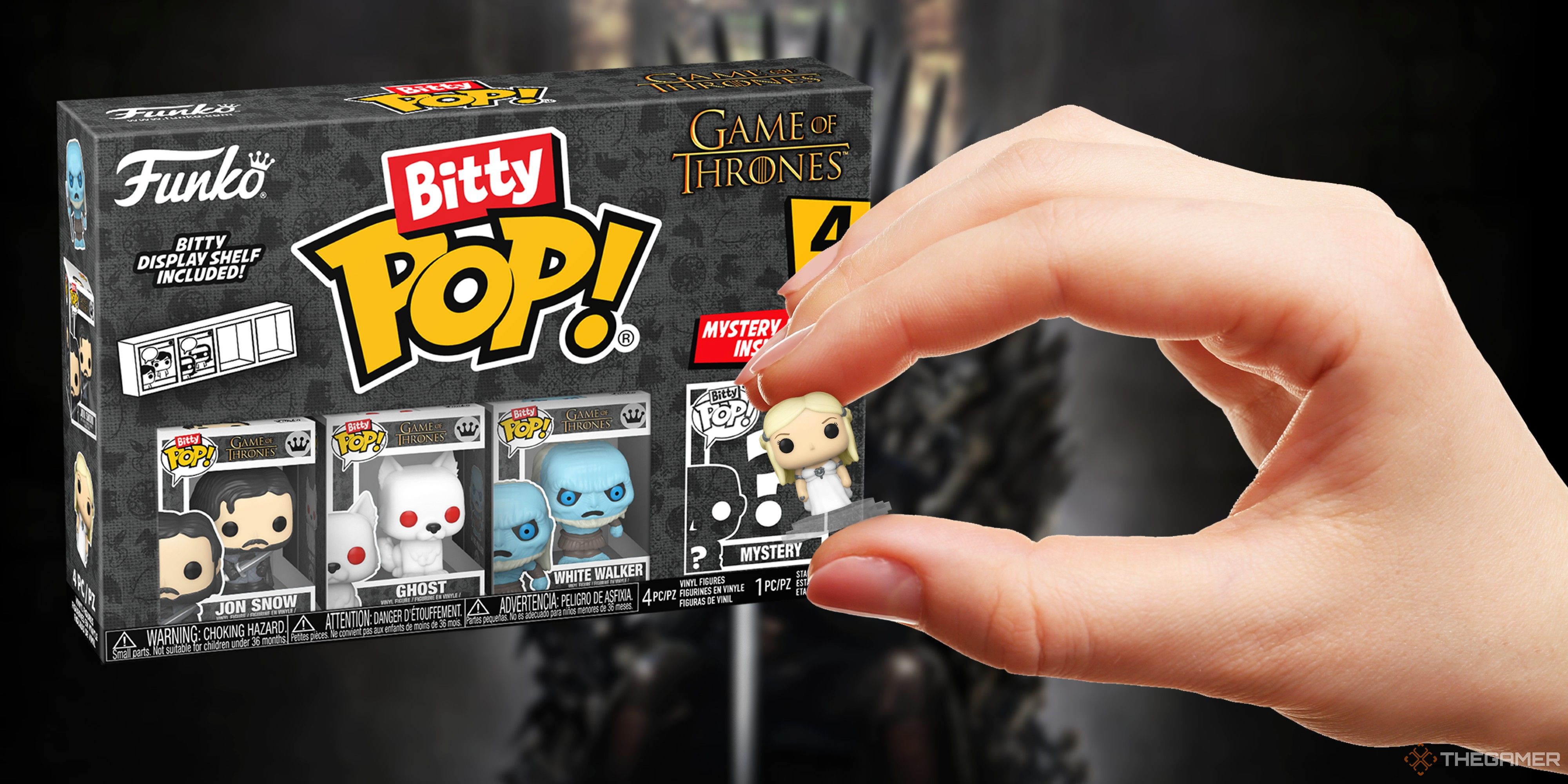 boxed game of thrones bitty pops and a hand holding the daenerys bitty pop