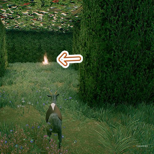 An orange arrow points the trophy that is inside a grass maze in Goat Simulator Remastered