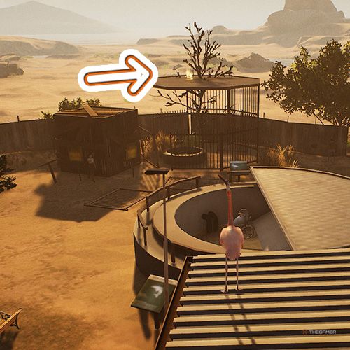 An orange arrow shows the location of a trophy that is located above the flamingo's cage in Goat Simulator Remastered