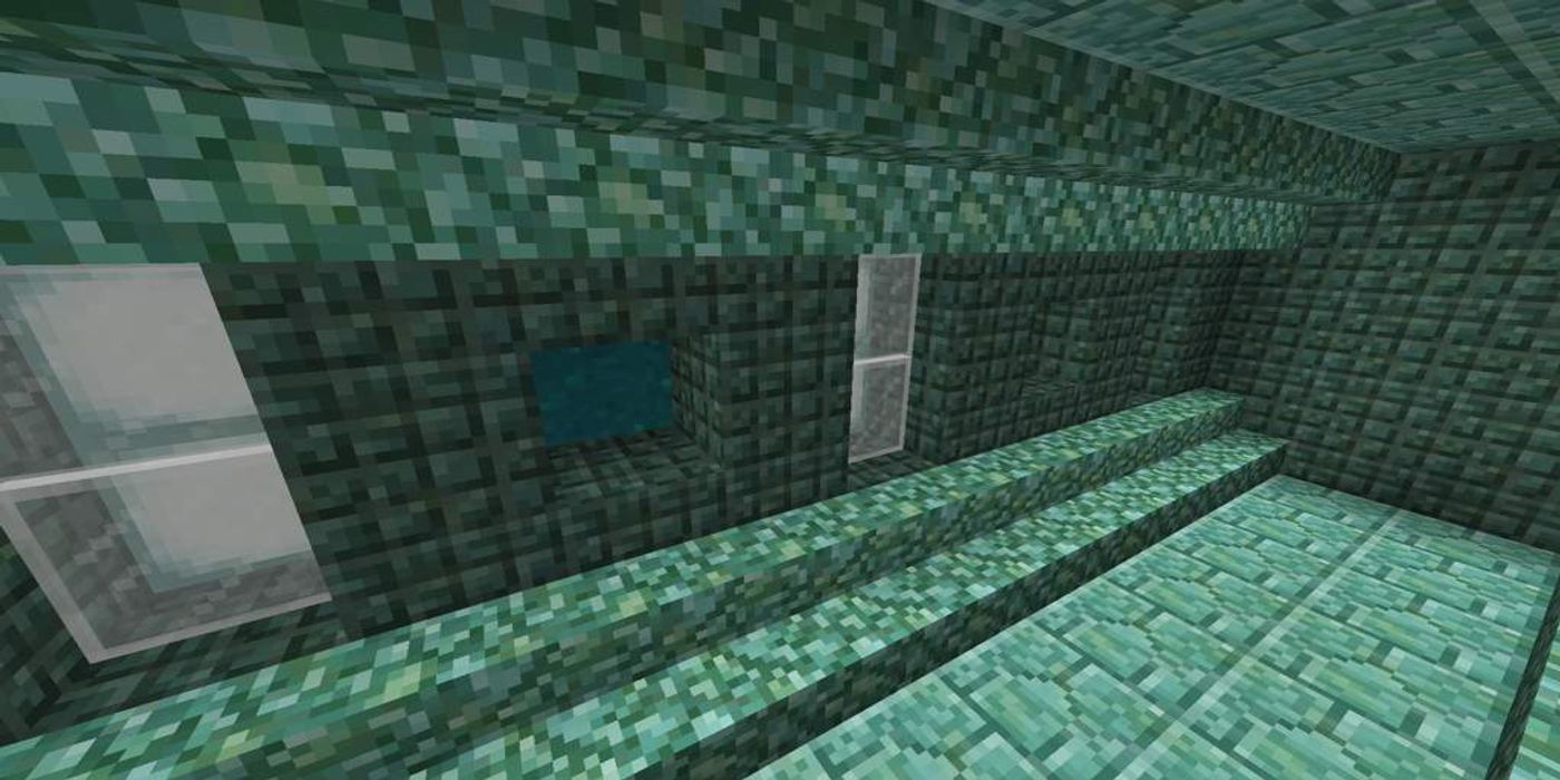 A player in an Ocean Monument looking at Prismarine Blocks. 