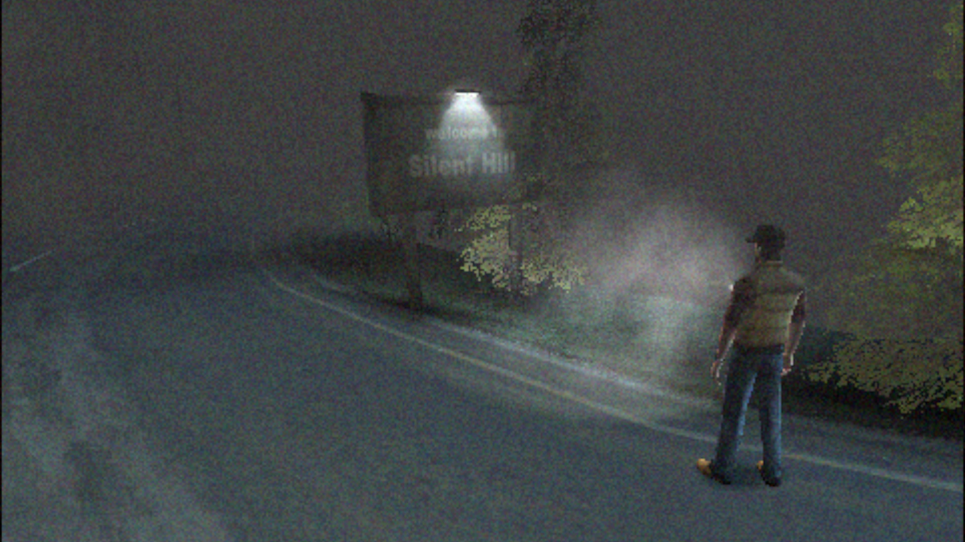 Travis approaches Silent Hill on a foggy street, indicated by a signpost, in Silent Hill Origins