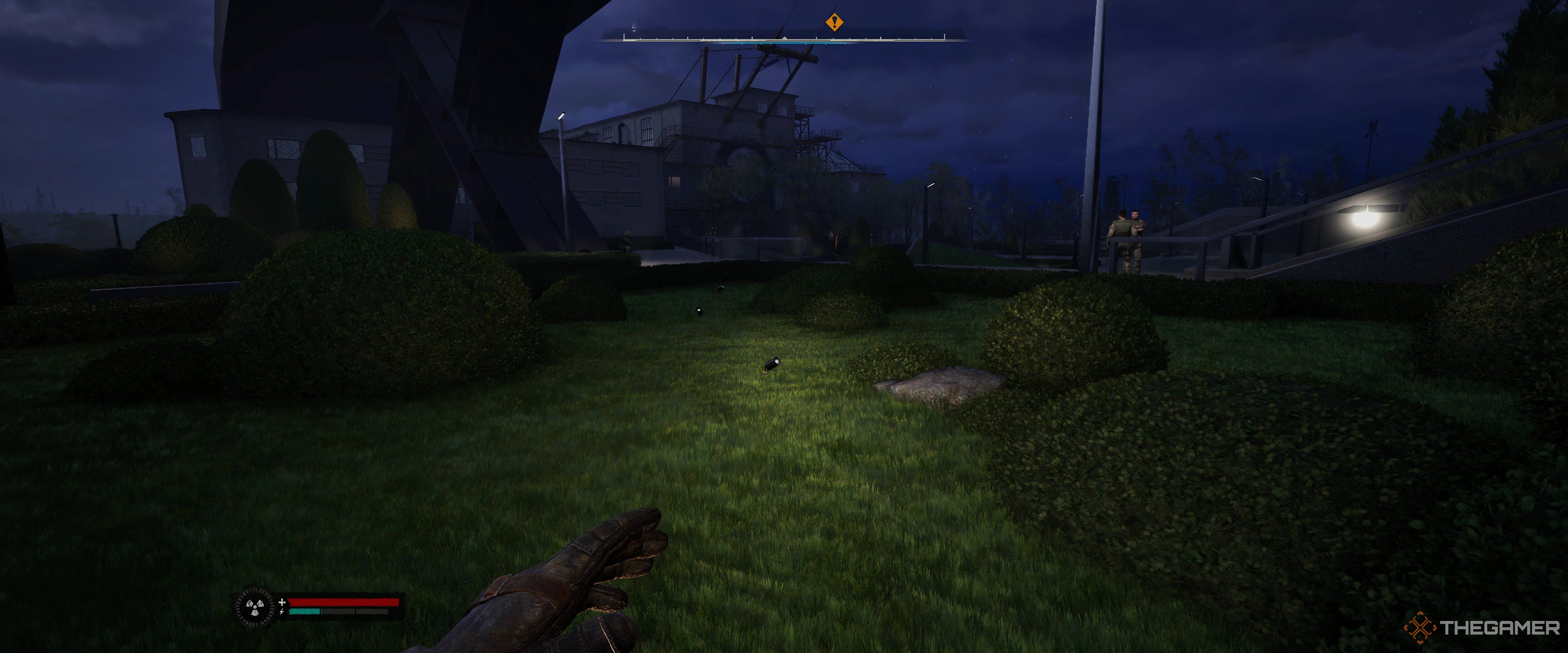 A garden leading to a warehouse in Stalker 2: Heart of Chornobyl.