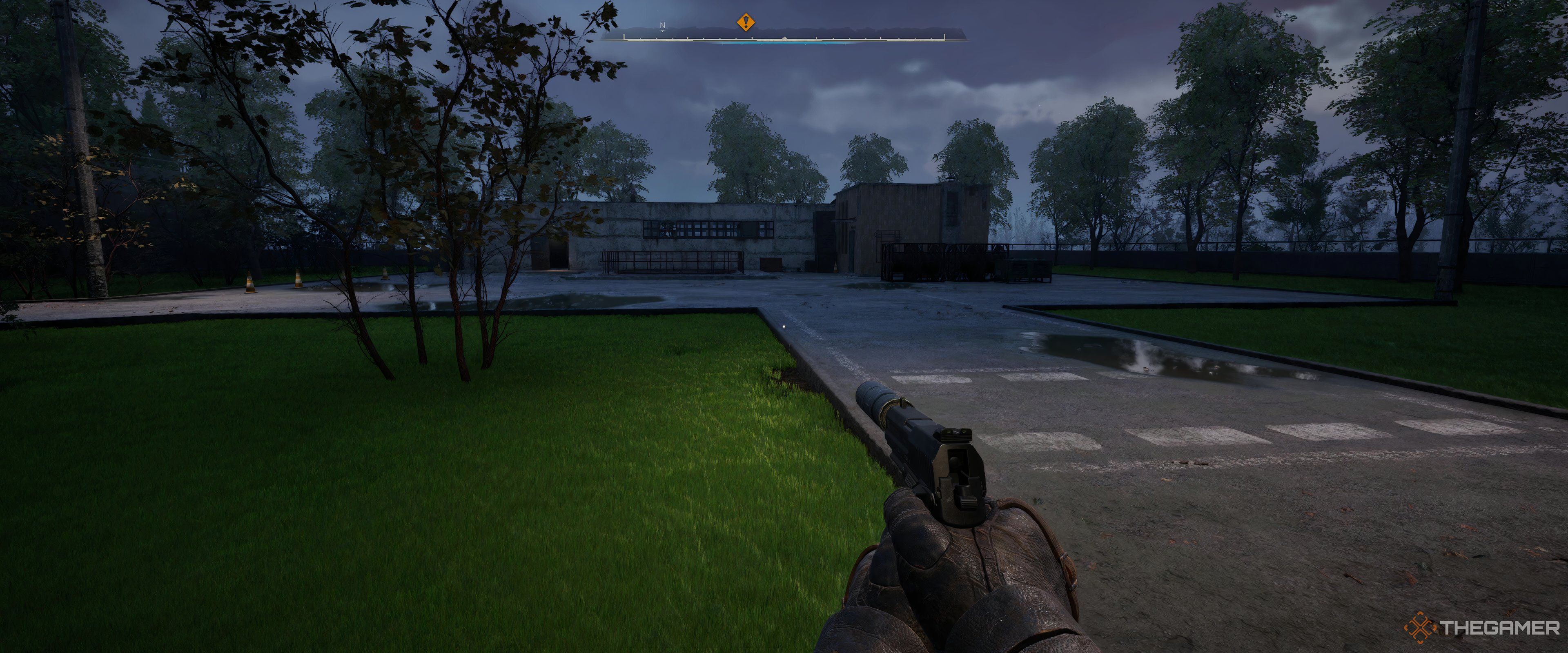 A clearing with a door at the other end in Stalker 2: Heart of Chornobyl.