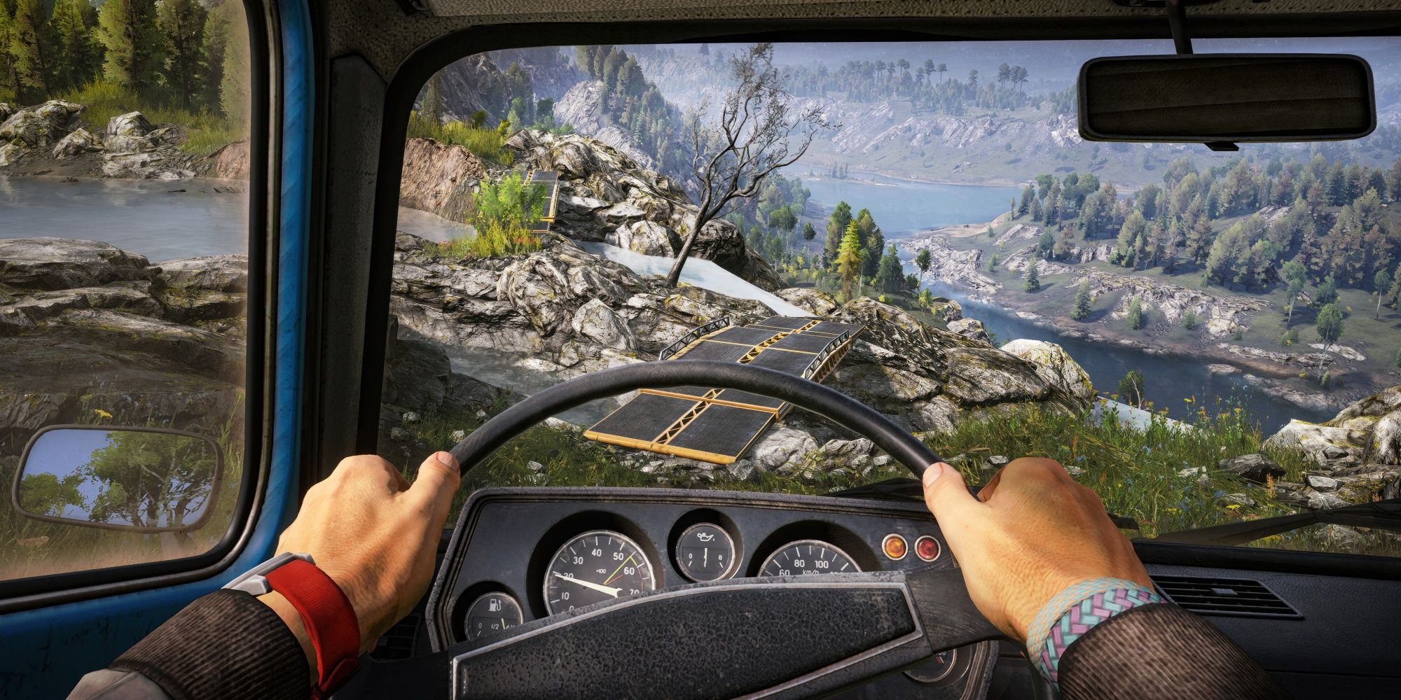 Expeditions: Driving Towards A Bridge In Rugged Terrain Seen From The Drivers POV