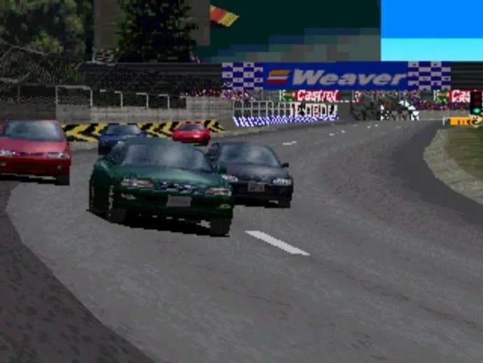 Gran Turismo PS1 screenshot showing a cinematic view of five cars coming round a bend