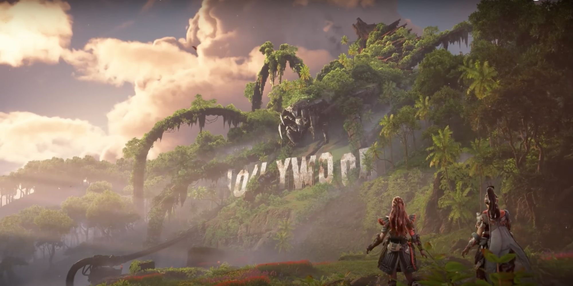 Aloy and Seyka face the overgrown Hollywood Sign and the Horus machine above it.