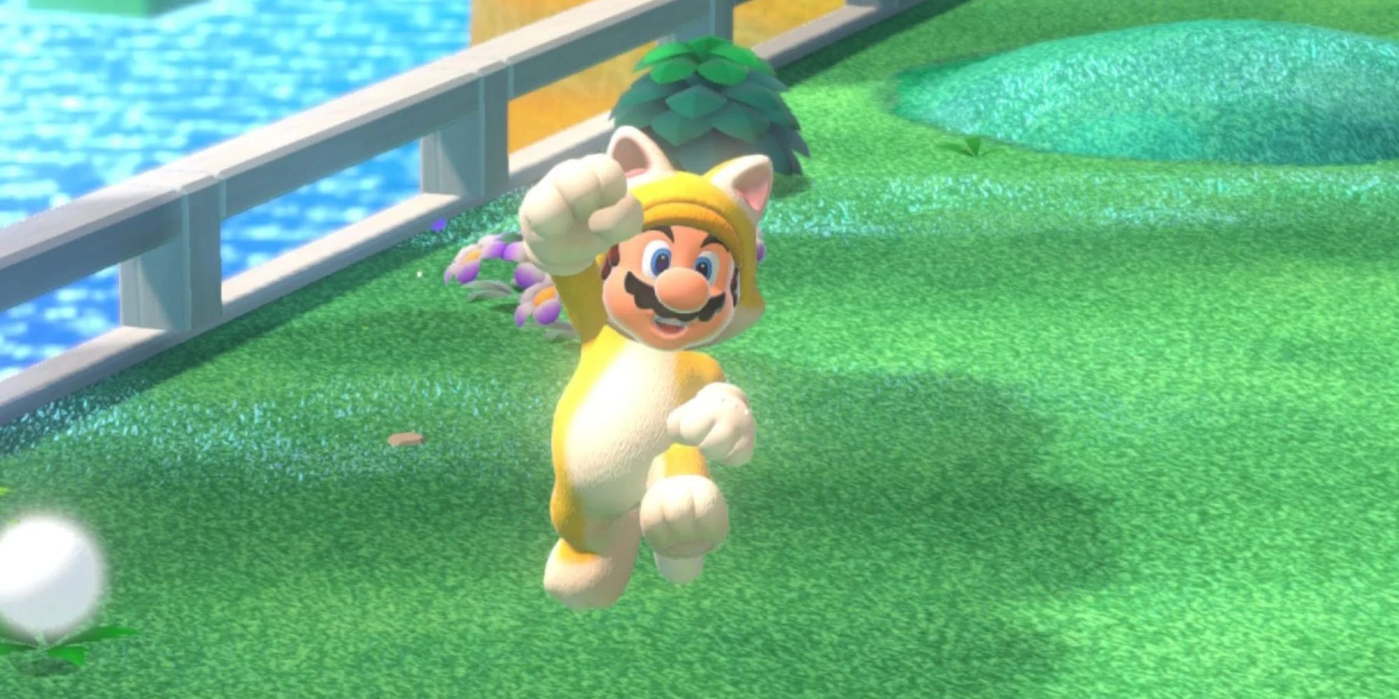 Cat Mario jumping on grass in Super Mario 3D World.