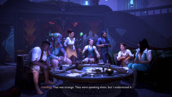 The companions in Dragon Age: The Veilguard gather around a small wooden table, talking.