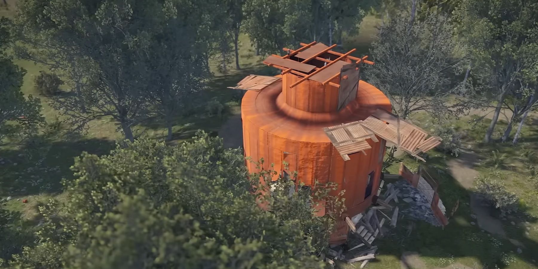 Image from Rust showing an abandoned structure in the middle of a woodland area.