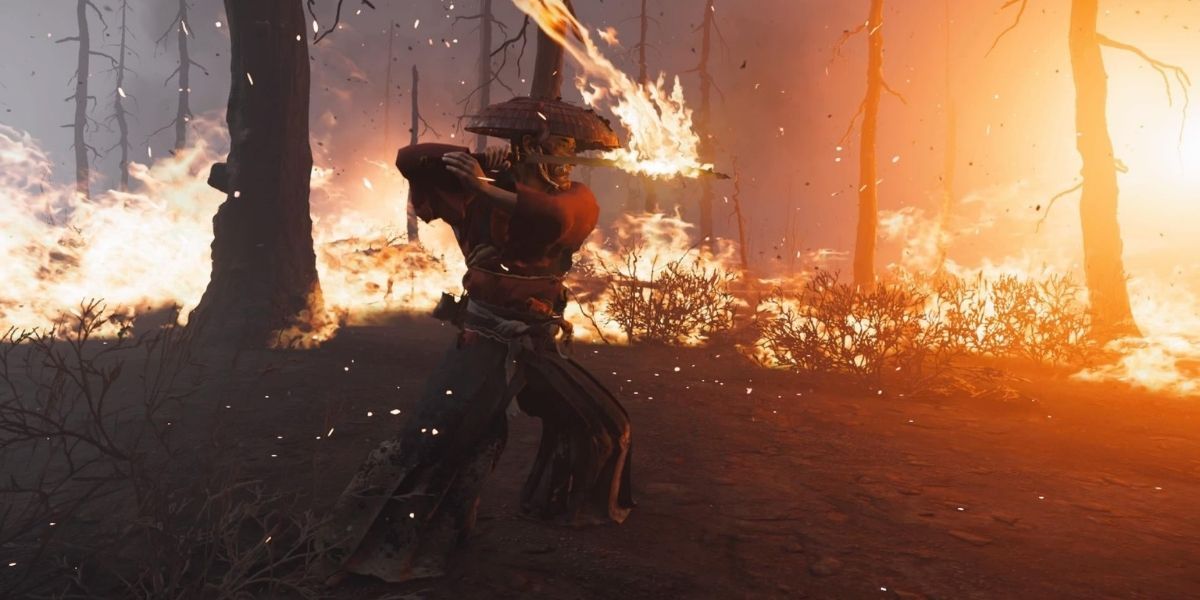 Jin brandishes a weapon coated in fire in Ghost of Tsushima