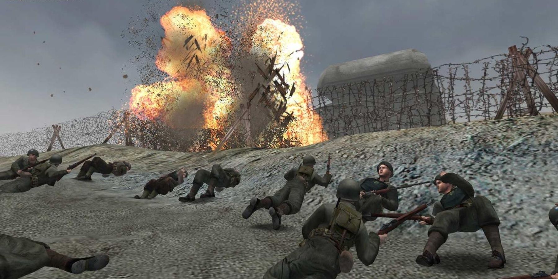 breaching a barbed wire fence on Omaha Beach