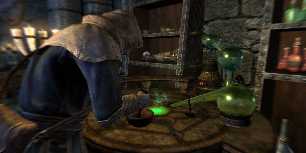 a character in hooded robes mixing potions in Skyrim