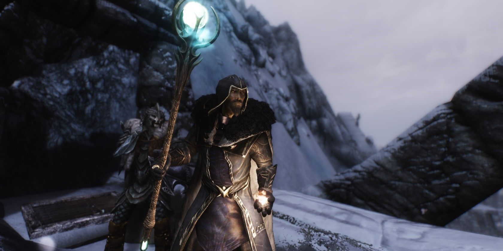 a mage holding the Staff of Magnus in Skyrim