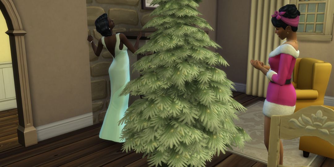 Two festive Sims decorate a Christmas tree together.