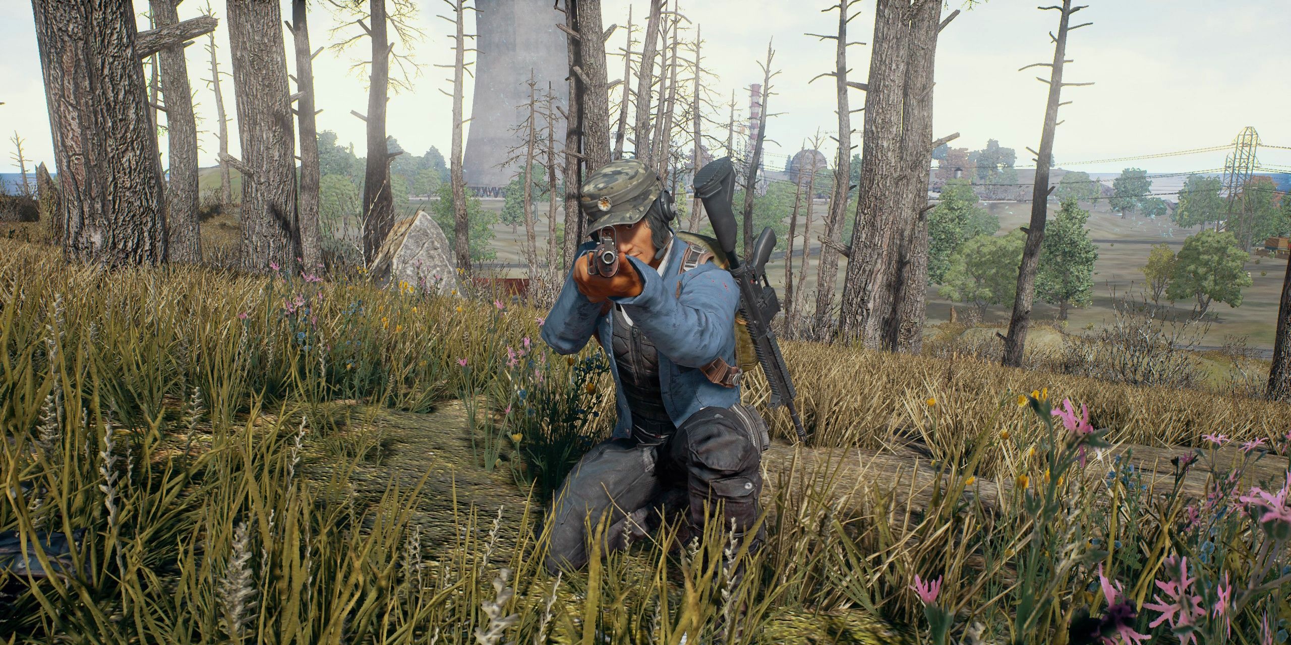 A screenshot showing man pointing gun at the screen in PUBG: Battlegrounds.